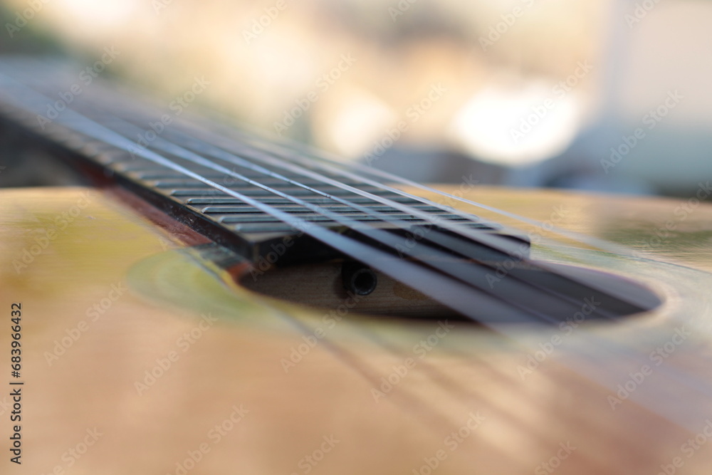 Fototapeta premium Front of an old guitar in nature