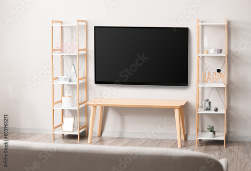 Modern smart TV set hanging...