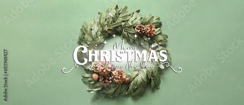 Fototapeta Naklejka Na Ścianę i Meble -  Beautiful greeting banner with Christmas wreath on green background