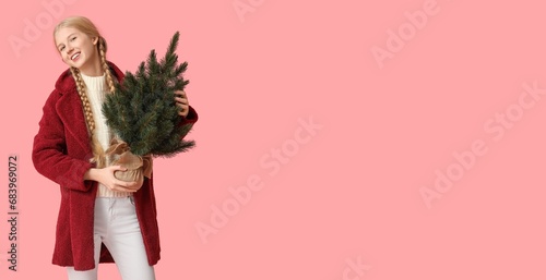 Pretty young girl holding C...