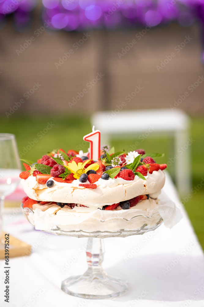 1 first birthday cake pavlova with fresh fruit berries flower candle
