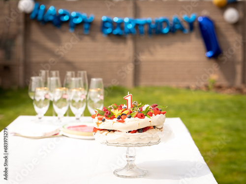 1 first birthday cake pavlova with fresh fruit berries flower candle