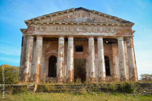 old architecture, ruins, Greek style, columns with the Doric order, triglyphic metope frieze, portico with pediment, entrance lobby, abandoned building