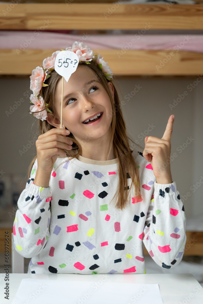 happy little girl in her play room making fun toy colours laugh