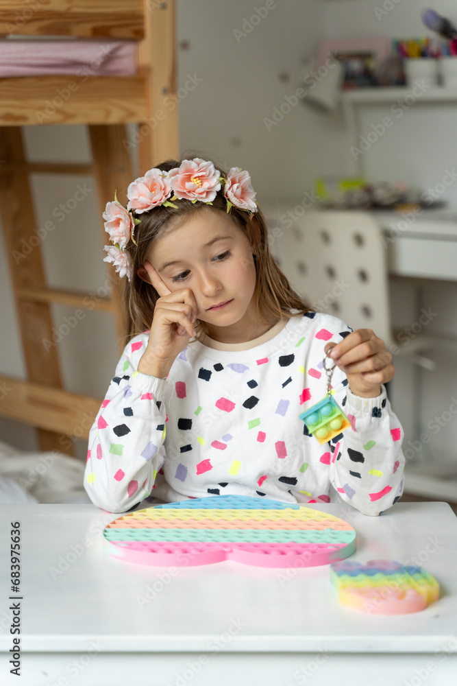 happy little girl in her play room trendy toy squishy smile