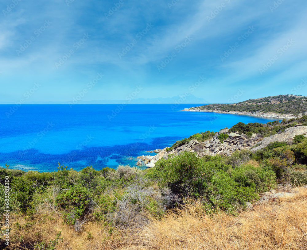 Summer sea scenery with aquamarine transparent water. View from shore (Sithonia, Halkidiki, Greece). Summer sea scenery with aquamarine transparent water. View from shore (Sithonia, Halkidiki, Greece).