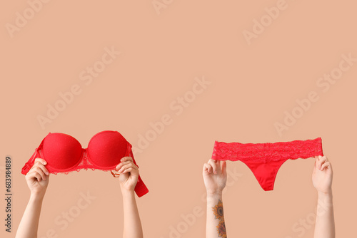 Female hands with sexy red ...