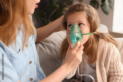 Sick little girl with her m...