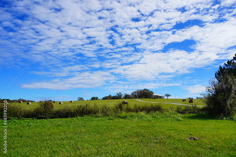 Round Hay stack in a florida farm and beautiful cloud Round Hay stack in a florida farm and beautiful cloud