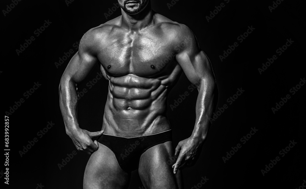 Fototapeta premium Muscular Torso. Sexy Man. Strong Muscle. Athletic Gay Posing Naked. Nude guy. Man showing muscular sixpack abs. six pack abs muscle. Fit male belly. Strong and Power Six pack Abs.