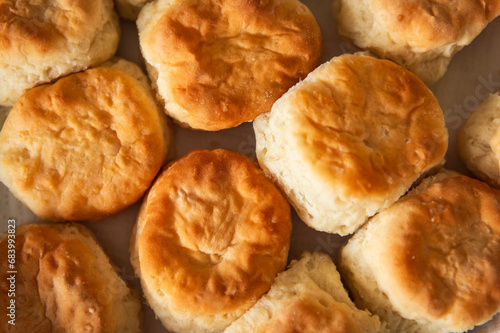 soft homemade biscuits arranged on a platter seen from above, closeup photo