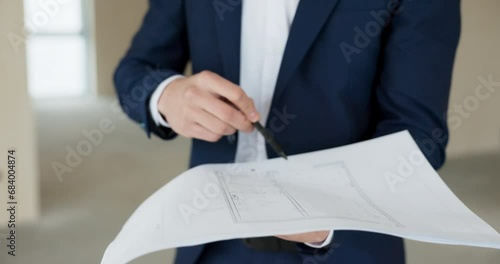 Happy successful middle eatern real estate agent holding building plan in hands talking about a new modern building house in a countryside. Delighted male showing house for sale after renovation. photo