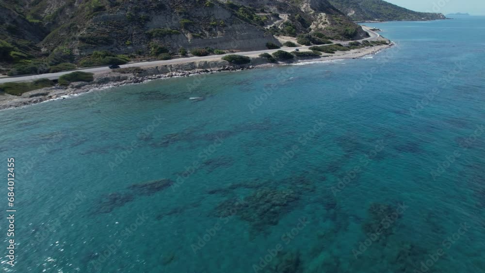 A Serene Coastal Oasis with Majestic Mountain Backdrop A Serene Coastal Oasis with Majestic Mountain Backdrop