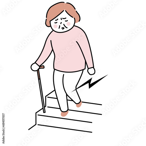 杖をついて階段を降りる女性