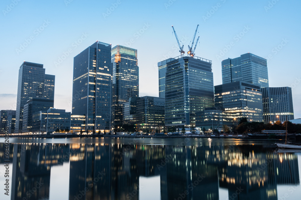 Reflections of corporate buildings in water, Canary Wharf, London