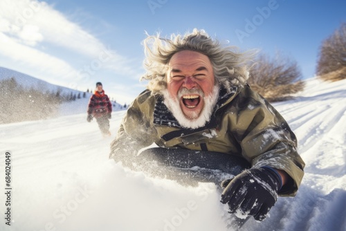 Older people friends riding on snow tubing from the hill with funny emotions