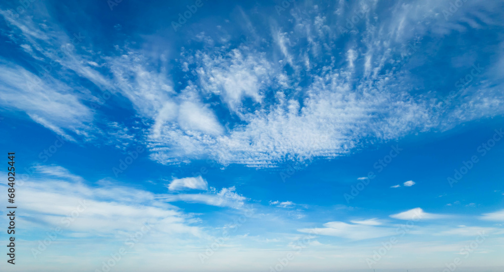 Wispy clouds in a blue sky