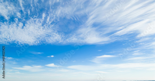 Wispy clouds in a blue sky photo