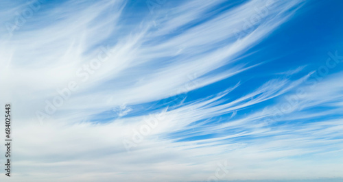 Photography Wispy clouds in a blue sky