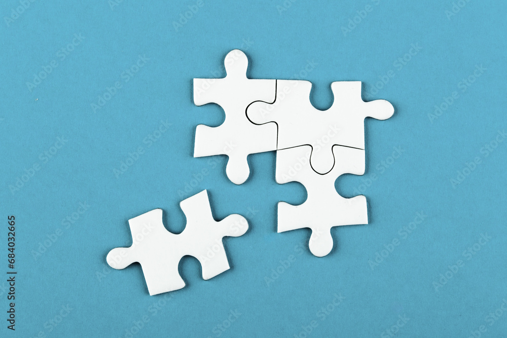Fototapeta premium Puzzle pieces on color background, top view, close up
