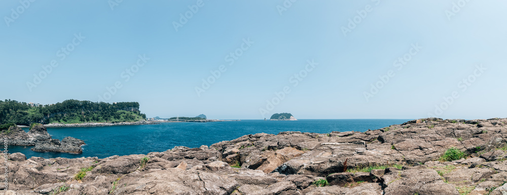 View of Seogwipo port Saeyeongyo Bridge and Munseom Island in Jeju Island, Korea