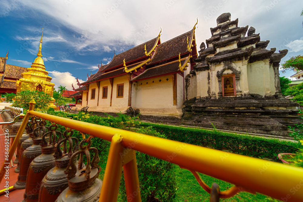 Beautiful Wat Buddhist temples in Chiangmai Chiang mai Thailand. Decorated in beautiful ornate colours of red and Gold and Blue. Lovely sunset Beautiful Wat Buddhist temples in Chiangmai Chiang mai Thailand. Decorated in beautiful ornate colours of red and Gold and Blue. Lovely sunset