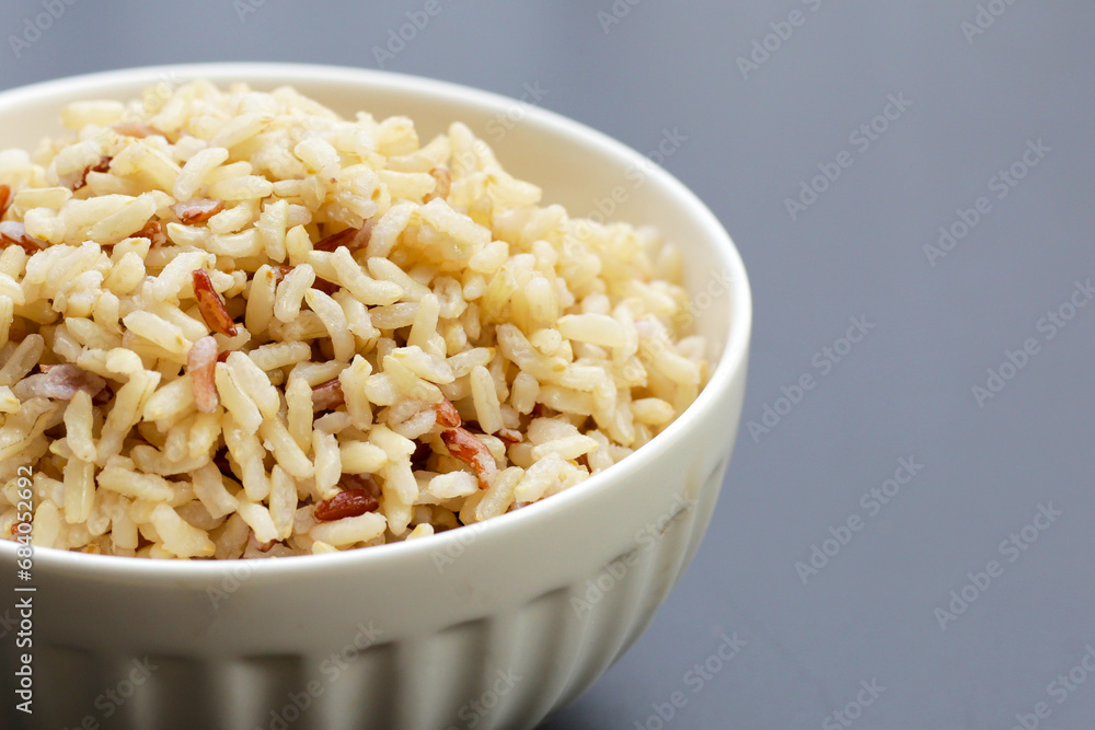 Cooked brown rice on dark background. Cooked brown rice on dark background.