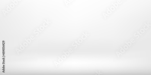 White and grey empty room studio gradient used for background and display your products. Graphic art design. Abstract bright grey background. Empty room with spotlight effect.