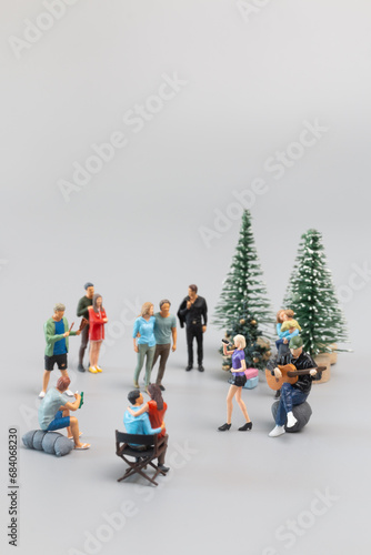 Miniature People , Families are joyfully celebrating and dining together. Concept of a Merry Christmas
