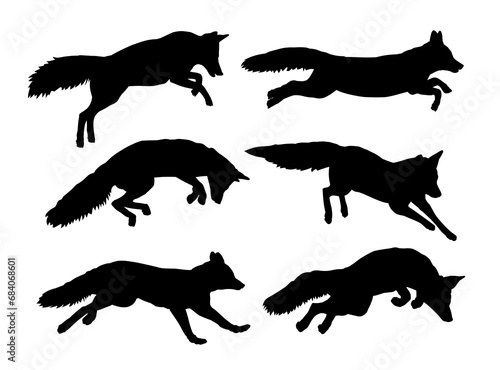 The set silhouettes of foxes on the run.
