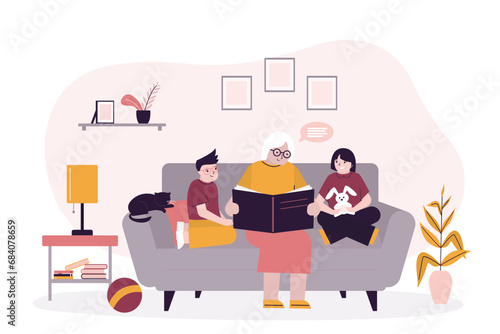 Grandmother with grandchildren sitting on sofa, family time. Granny reading fairytale story book to little kids. Happy family, childhood. Living room interior with furniture