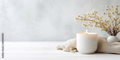 interior photo of a Candle Copy Space decorated with a white cloth beside it photo