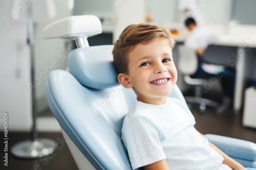 Child sitting in dentist's chair for checkup cloose up