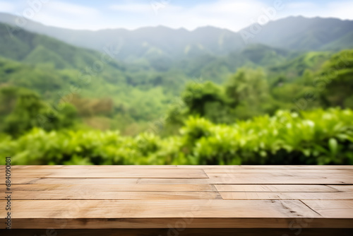 Empty wooden table light brown wood texture Blurred background, natural view Flower garden and blurred mountains © WITCHA