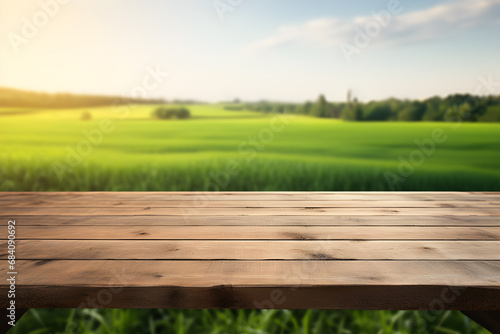Empty wooden table light brown wood texture Blurred background, natural view Flower garden and blurred mountains © WITCHA