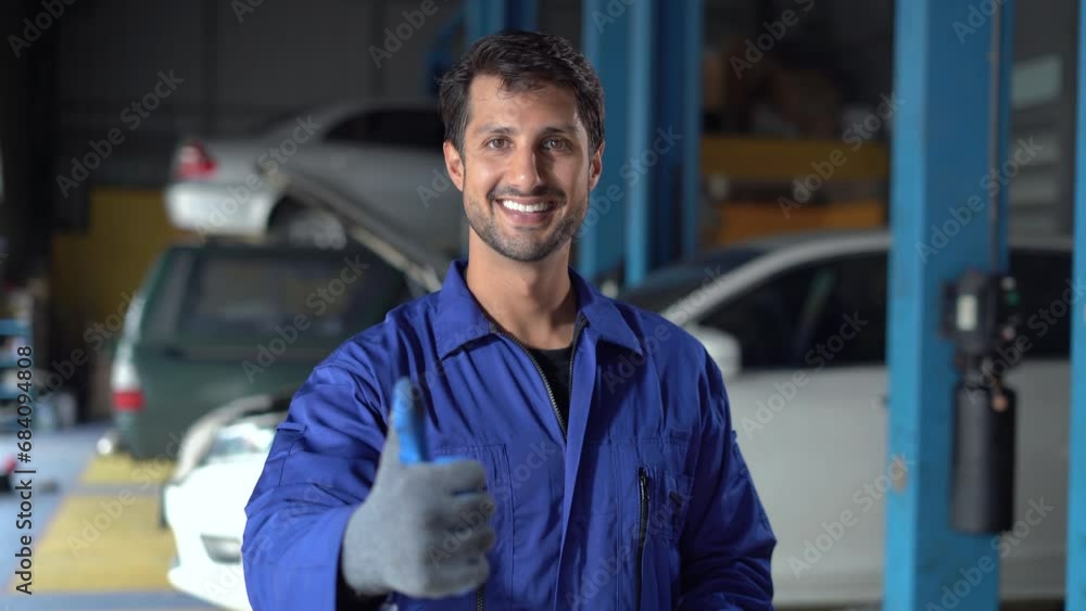 happy latin auto mechanic man checking car with clipboard gesturing show thumbs up and looking at camera in garage cars service . hispanic technician repairing vehicle at garage . happy latin auto mechanic man checking car with clipboard gesturing show thumbs up and looking at camera in garage cars service . hispanic technician repairing vehicle at garage .