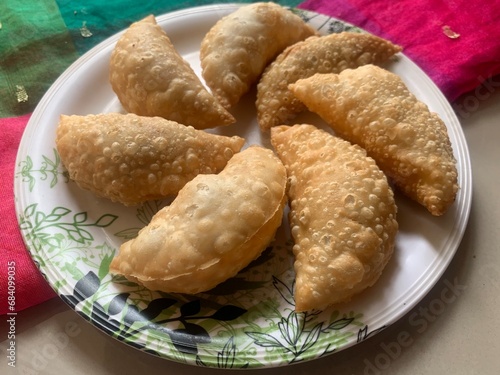 Gujiya or gujia or karanji - sweet dumplings. Indian snack made on diwali, holi and for celebrations called karanji in Maharashtra and Ghujia in central India