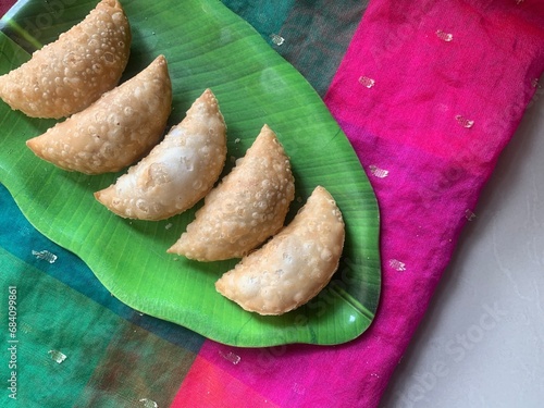 Gujiya or gujia or karanji - sweet dumplings. Indian snack made on diwali, holi and for celebrations called karanji in Maharashtra and Ghujia in central India