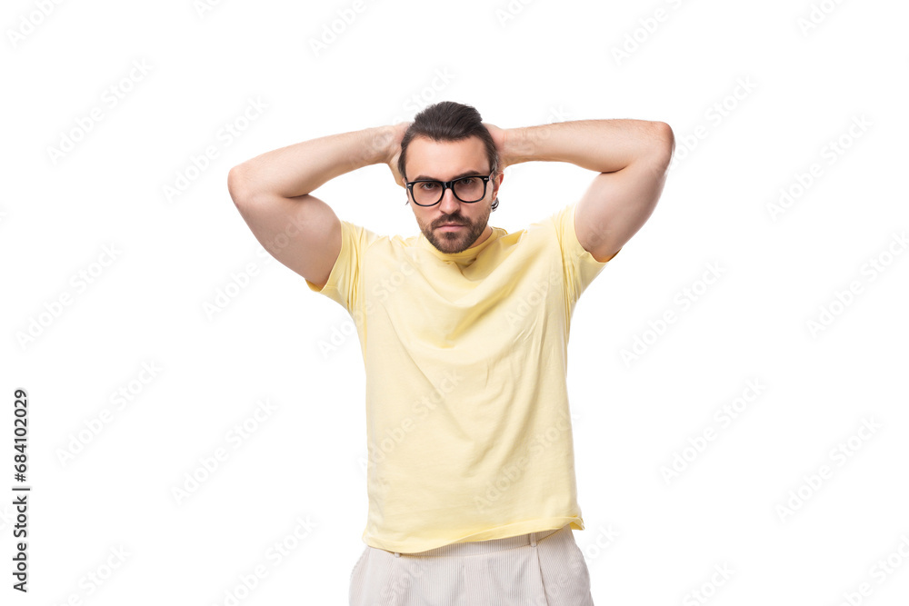 well-groomed young caucasian man with black hair and beard wears glasses for image well-groomed young caucasian man with black hair and beard wears glasses for image