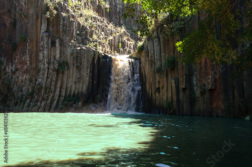 Basaltic Prisms of Santa Maria Regla. Tall columns of basalt rock in canyon, Huasca de Ocampo, Mexico photo