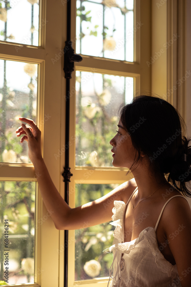 bride and groom looking out window