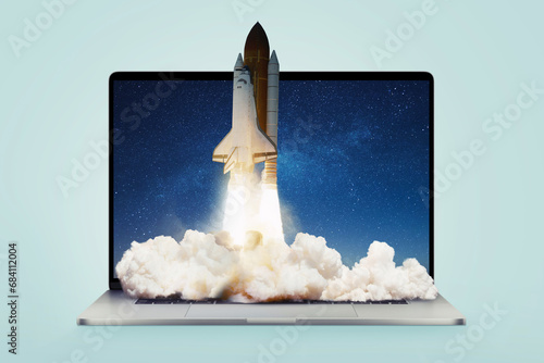 Fototapeta Naklejka Na Ścianę i Meble -  Creative laptop and rocket with smoke and blast lift off up, creative idea. Boosting applications and workflows, concept. Launching the shuttle spaceship from a laptop. Startup and rapid growth