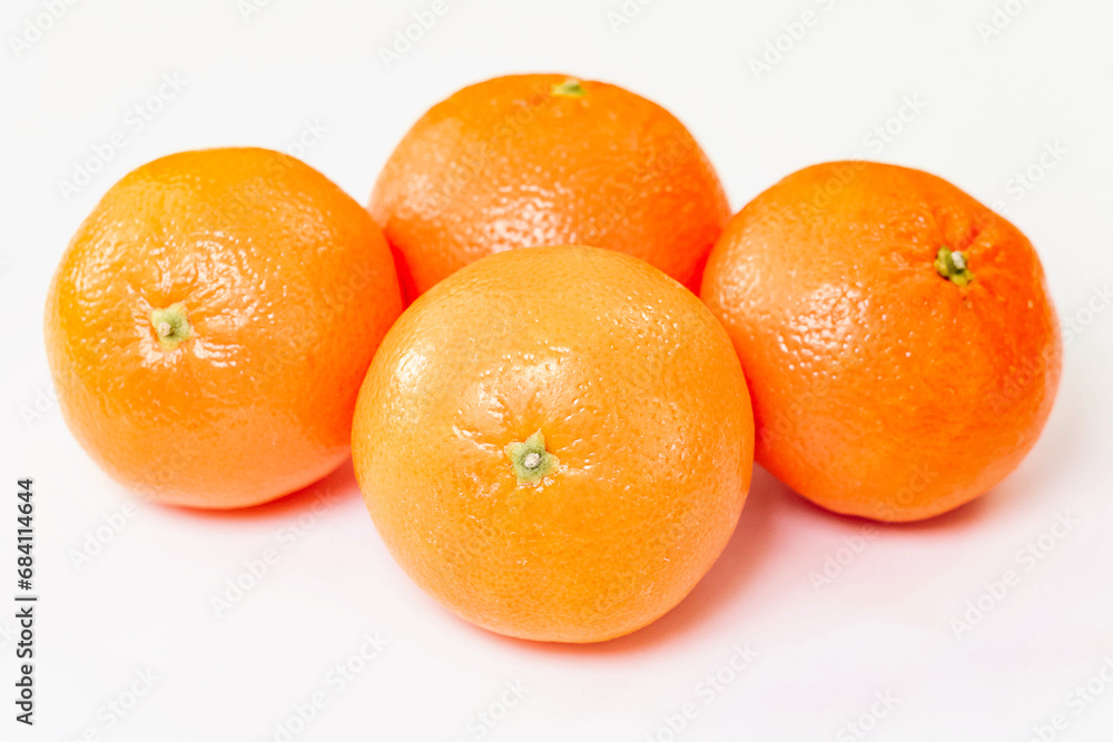 Tangerine or clementine with green leaf isolated on white background Tangerine or clementine with green leaf isolated on white background