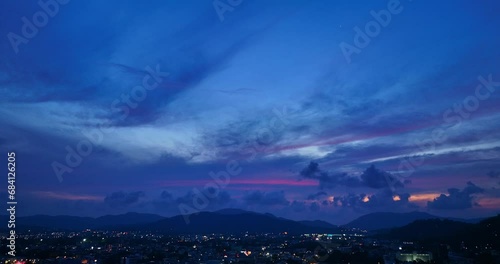 .aerial view The lights twinkled along Talang walking street at night..Bright colors along the beach city area at night..beautiful sky in twilight. photo