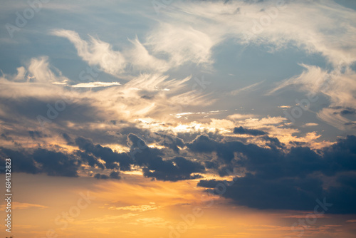 Orange sunrise on the horizon with emphasis on the sun's rays and birds in the distance. Idyllic Setting © Adilson