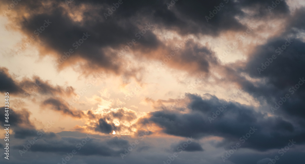 Sunset sky with gray clouds. Evening sky nature background