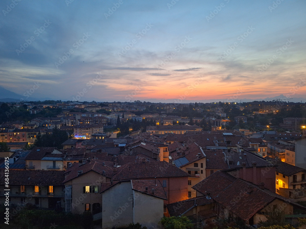 View of a small town at sunset, a beautiful contrast between the houses and the landscape