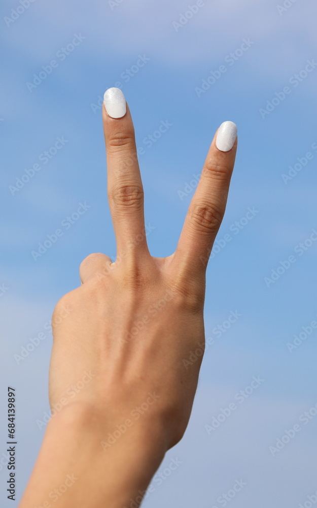 hand making the V sign with two fingers means Victory or success hand making the V sign with two fingers means Victory or success