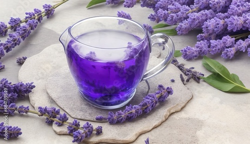 Fresh delicious tea with lavender and lavender flowers on gray stone table