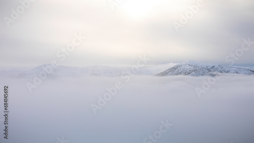 fog over the mountains in winter
